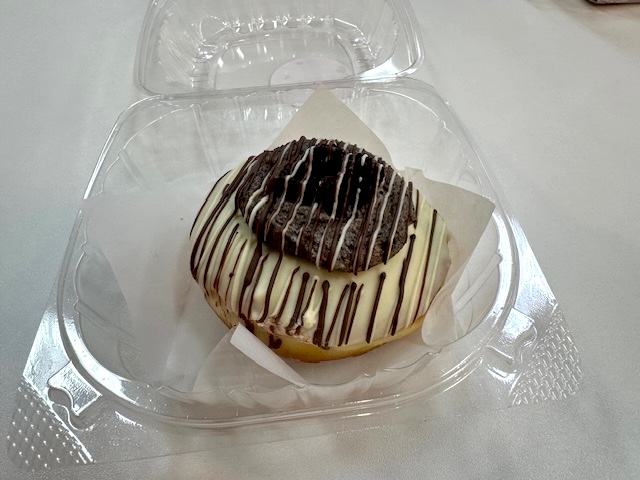 Danny holding his donut from Flour Fresh Cream Donut