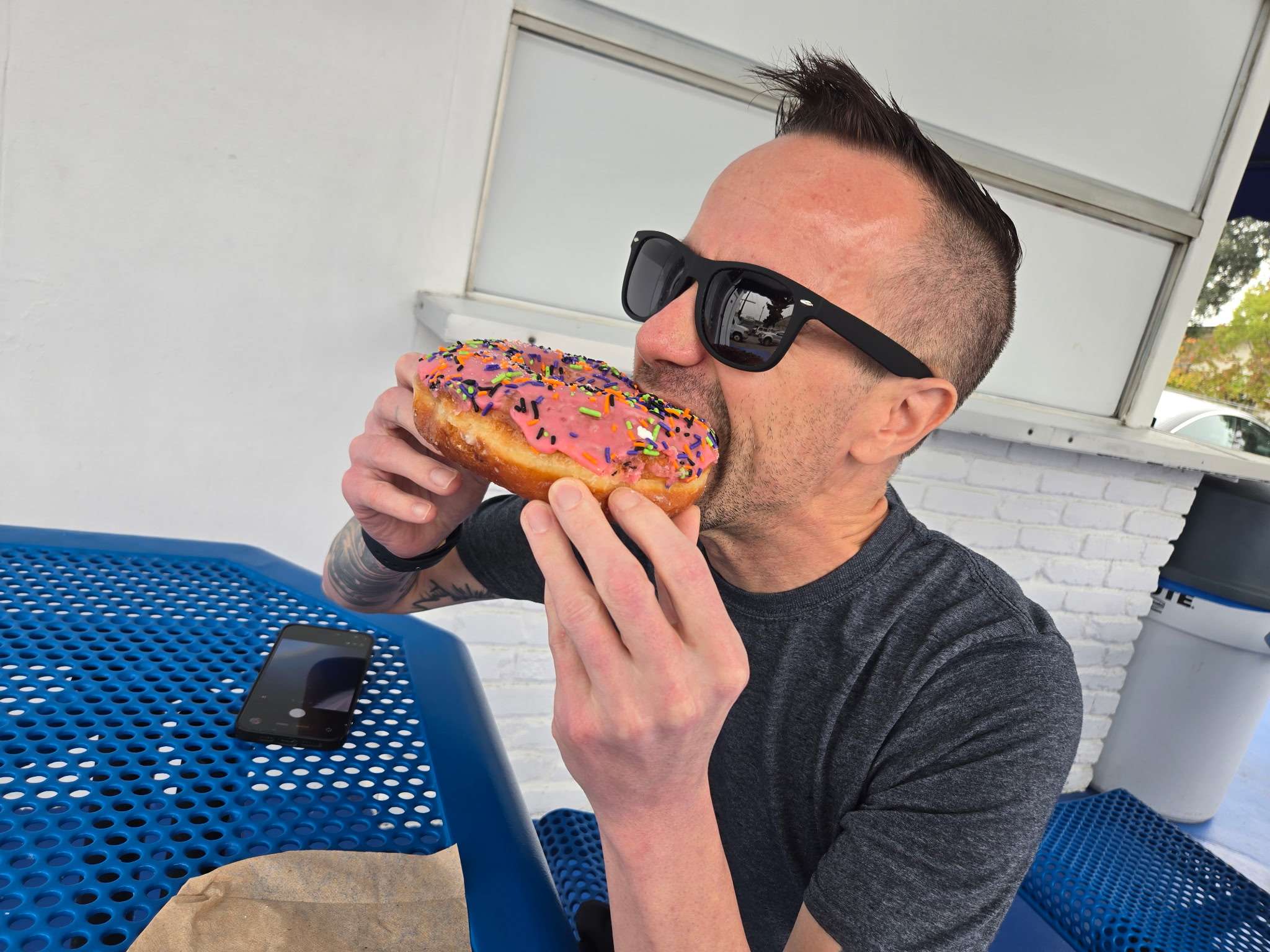 Danny (me) devouring a giant donut from Rolling Pin.